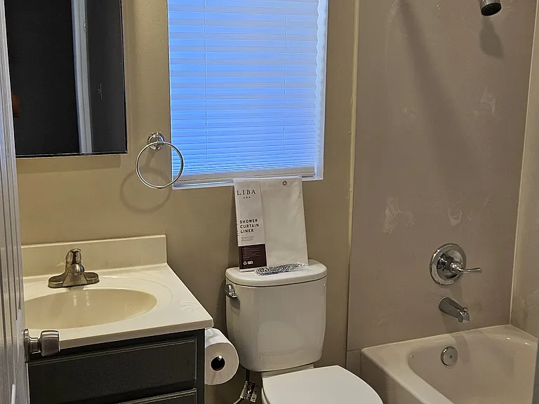Guest bathroom with newly tiled floor