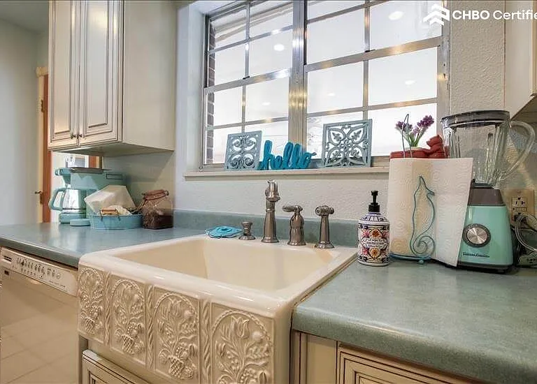 Kitchen has color coordinated beyond.