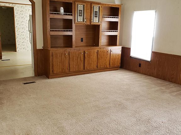 Living room showing built in entertainment center