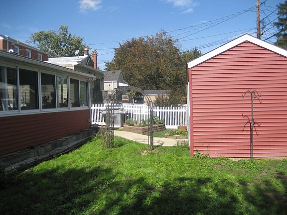 Fenced yard with new shed