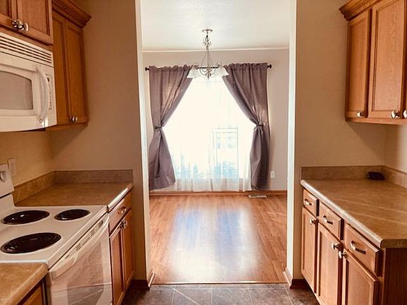 Kitchen looks into dining room.