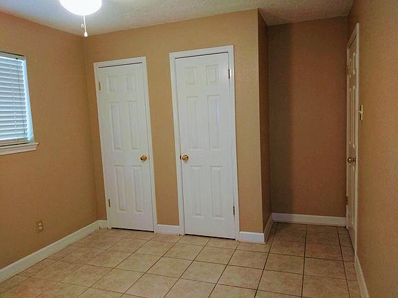 The second bedroom has plenty of storage in the closets.