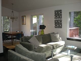 Living room with picture window, skylights