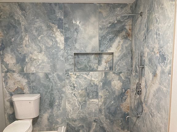 New tiled bathroom -- shower curtain rail will be installed