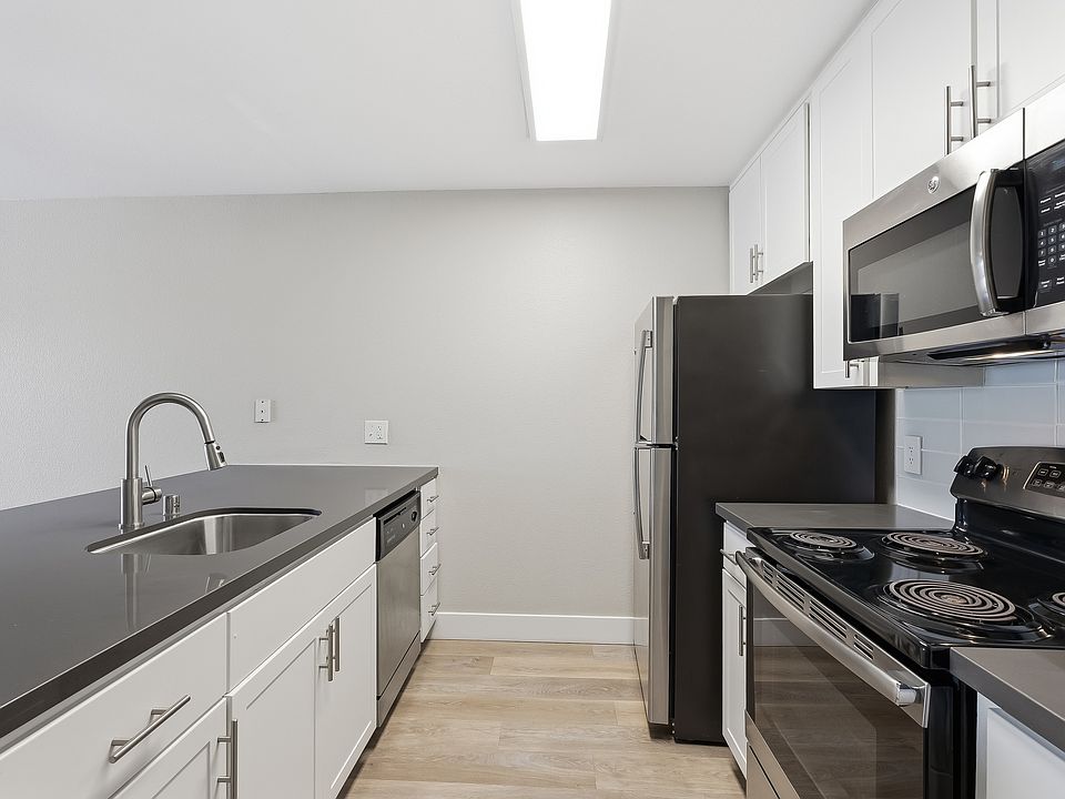 Your gourmet kitchen features brushed nickel finishes and generous storage.