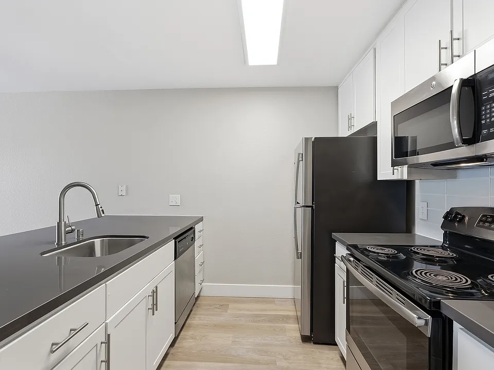 Your gourmet kitchen features brushed nickel finishes and generous storage.