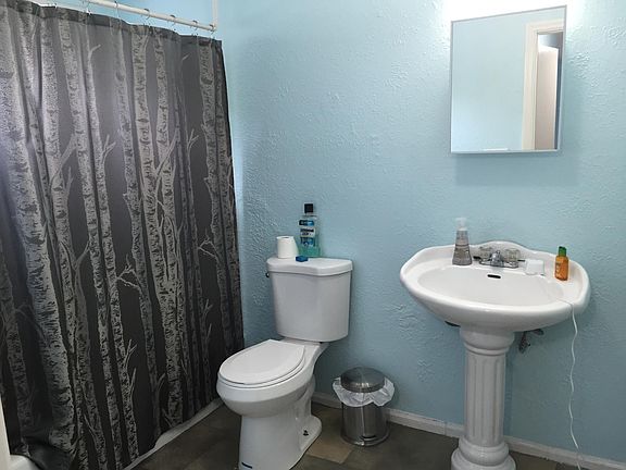 Bathroom with tub and shower.