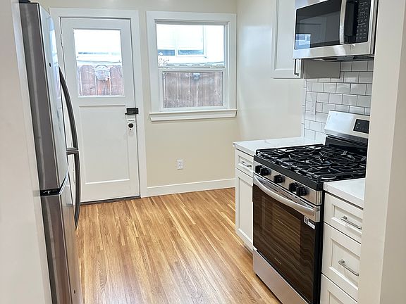 Kitchen with eat in area and back door