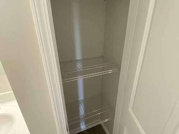 closet in bathroom hallway.