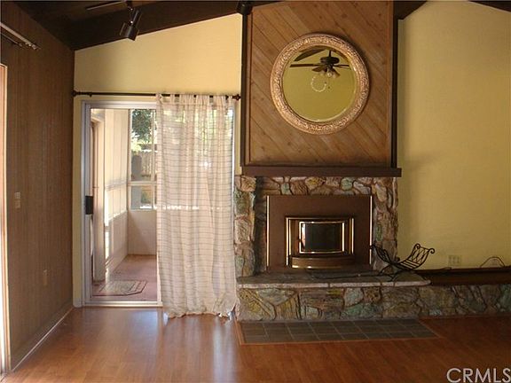 Living room offers  patio doors to the charming screened in patio.