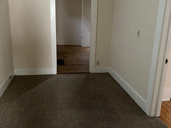 Bonus room between Living room and dining room. Door on right is main level bedroom.