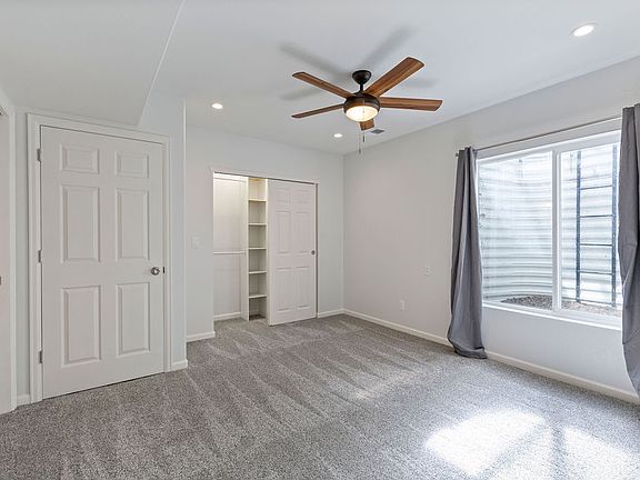 Well lit bedroom with en-suite full bathroom