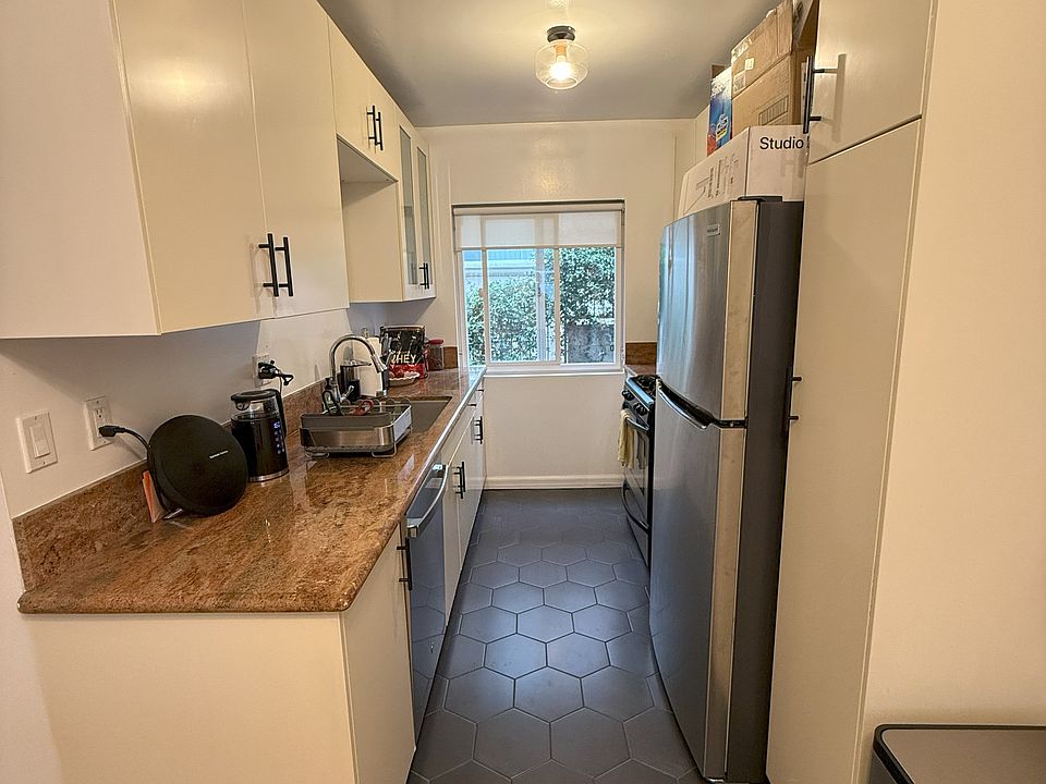 KITCHEN - NEW TILED FLOORS & ALL NEW APPLIANCES.