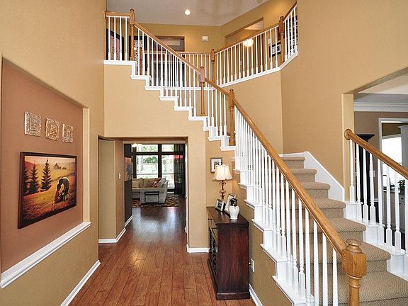 Upon entering the home, you are greeted by a wide-open two-story Foyer; dining to the right, study to the left, and family area straight ahead.