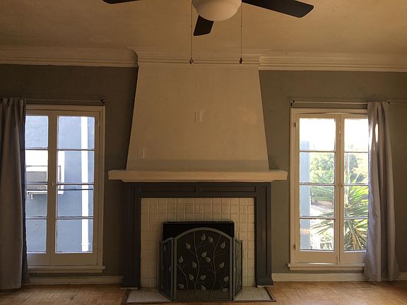 Living room facing fireplace.