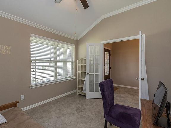 Beautiful study with French doors and soaring ceilings.