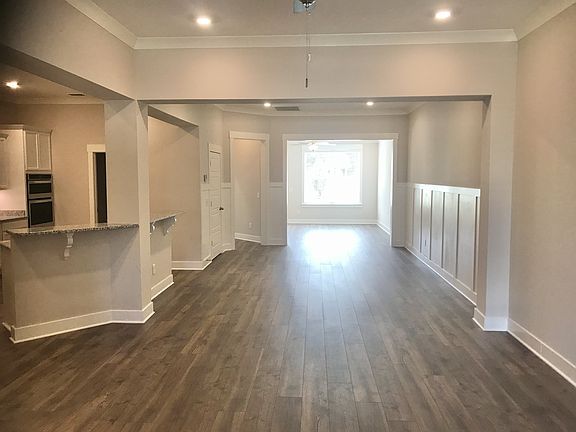Stock photo looking in from front door. In the home under construction, the very back room will be