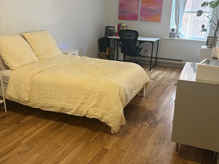 Another view of bedroom with work space in natural light