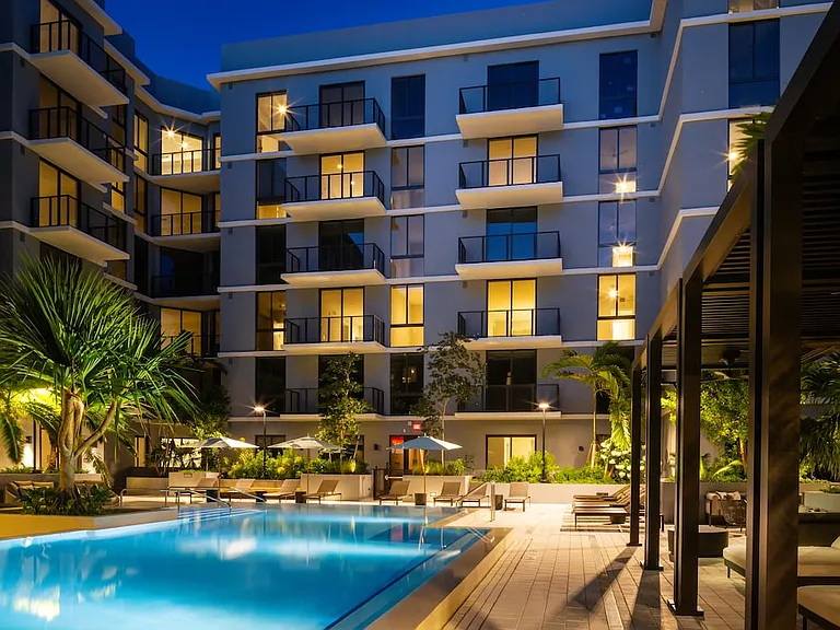Resort-style pool with sundeck and cabanas