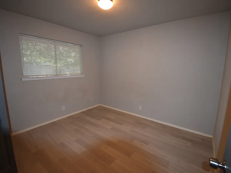 Guest bedroom with view to the private patio