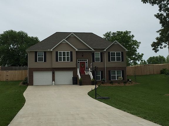 nice driveway with full two car garage PLUS added room for storage