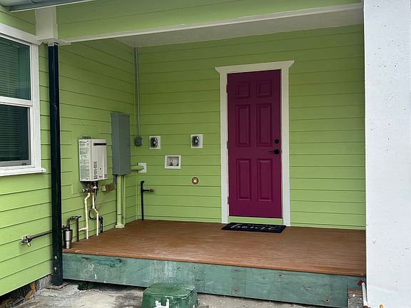 the back porch. this is were the washer and dryer are, and the BBQ is at the column