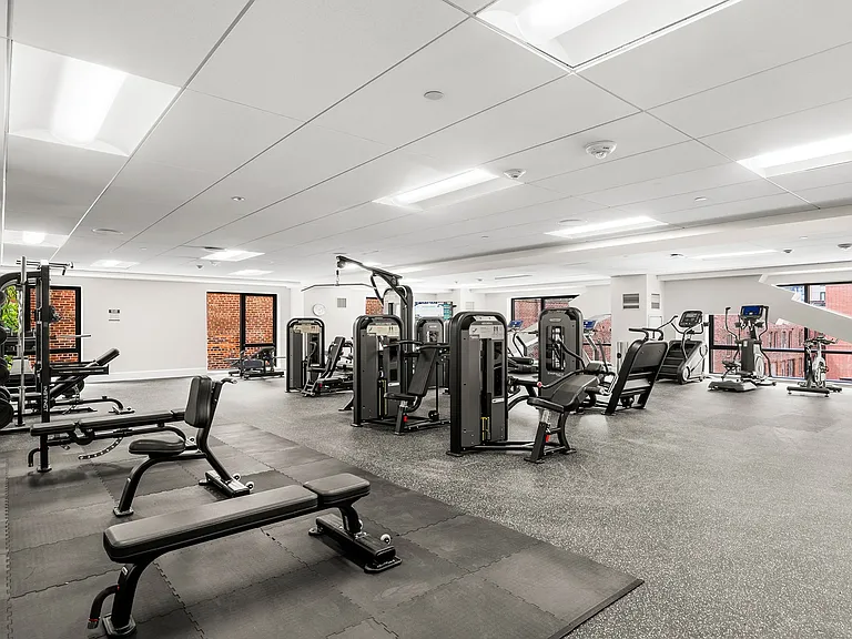 The fitness center is equipped with both free and machine weights