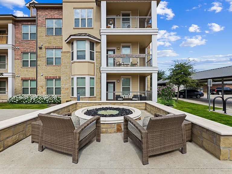 Enjoy outdoor entertaining spaces at Auberge of Burleson apartments in Burleson, Texas.