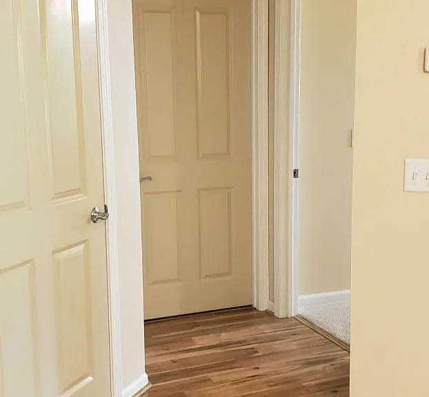 More of the laminated wood flooring paves the way to the bedroom and bath.