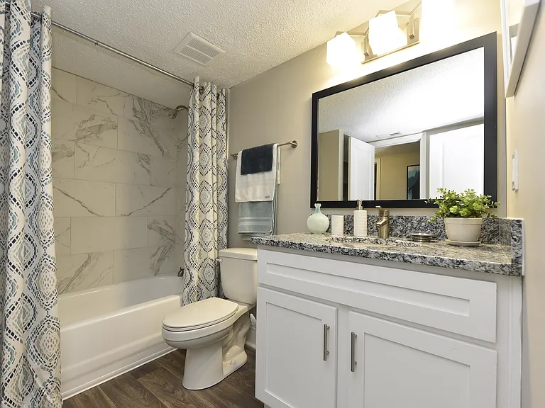 Experience luxury and comfort in this impeccably designed bathroom space.
