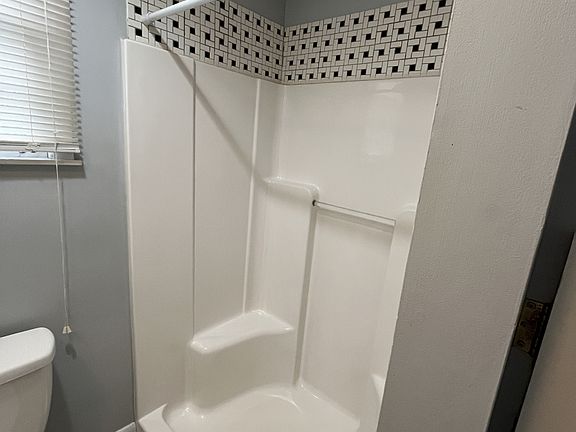 Upstairs full bath off of the kitchen.