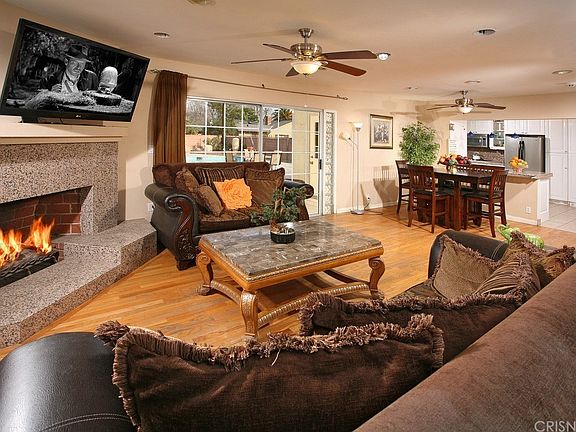 The living room is bathed in natural light from a