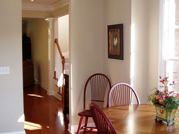 Eating area in kitchen looks out onto front courtyard.