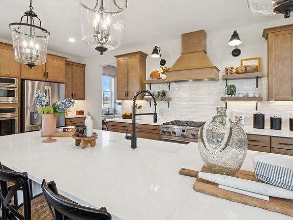 Kitchen with pendant lights over island