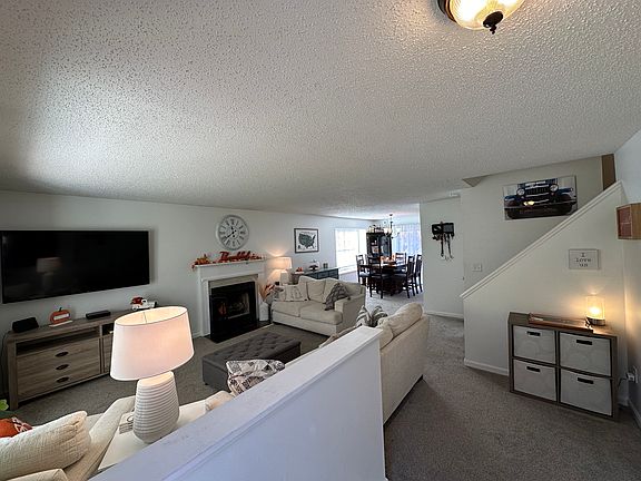 Front door view of main floor of condo. There is a half bath to the right.