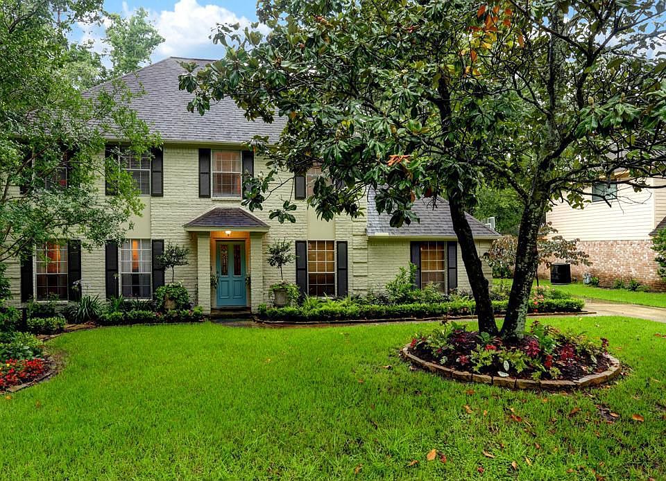 Beautiful two story home with lush landscaping.