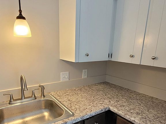 Kitchen includes refrigerator, stove, dishwasher and slider access to your private patio.