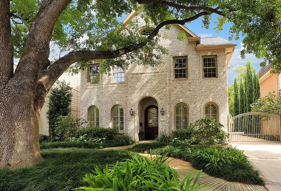 Gorgeous West U home within easy walking distance to Rice Village shops & restaurants. Custom Brick 
