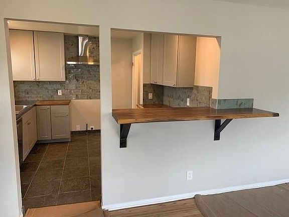 Kitchen is done now! This was taken before the stainless gas stove was installed.