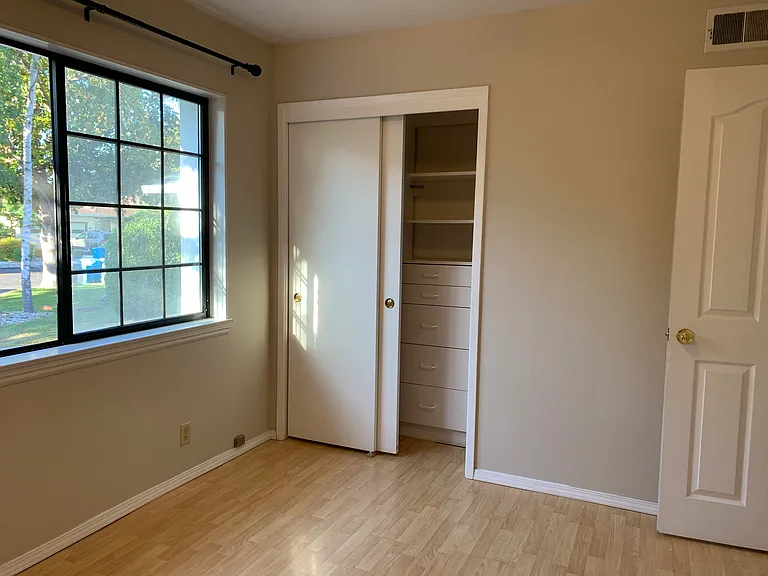 Bedroom 2 with custom closet organization system