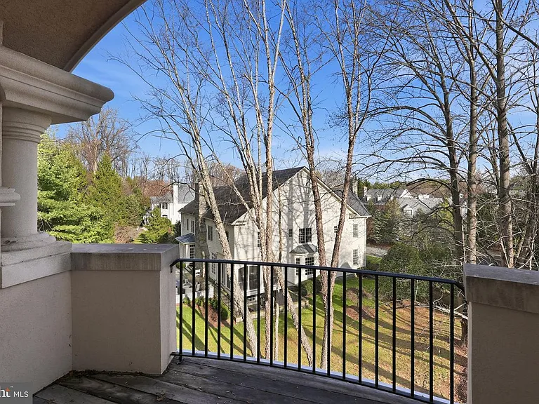 Serene balcony view with lush greenery.