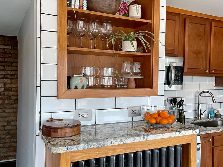 Chef's kitchen with custom maple cabinets, Venetian Granite countertops, deluxe Stainless Steel appliances (quiet Bosch Dishwasher, Ice/Water Kitchenaid Refrigerator, Convection LG Gas Range, and LG over-the-range microwave), build-in bookshelves with Win