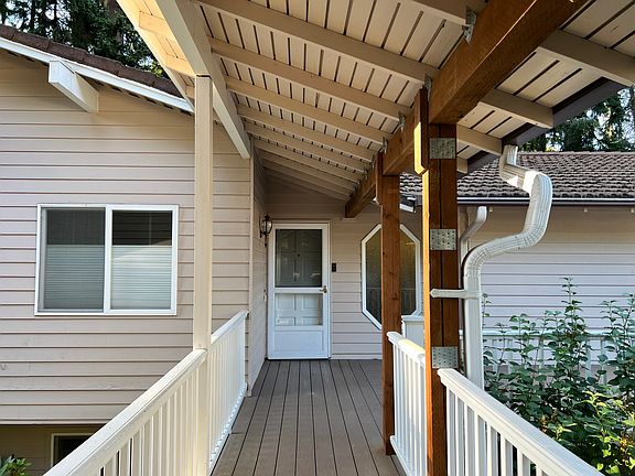 Detached garage with covered breezeway access to the home.