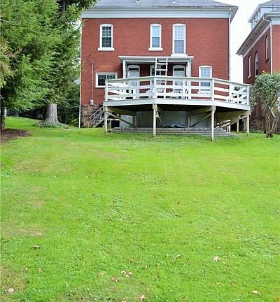 Beautiful rear yard offers off-street parking and an above ground pool.