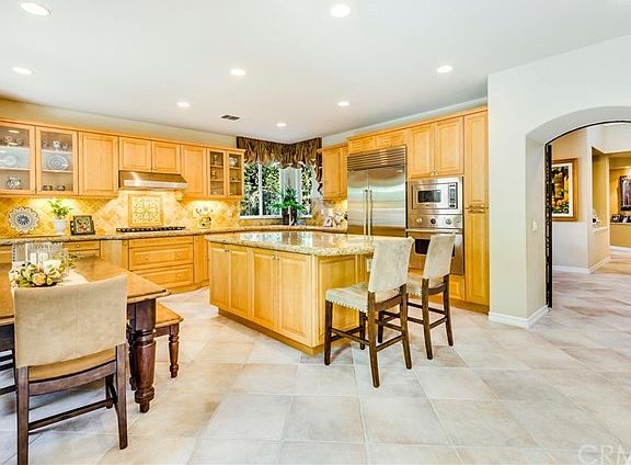 Gourmet kitchen features roomy nook for informal dining and a large center island perfect for cookin