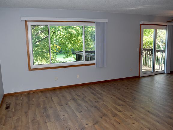 Beautiful and neutral formal living room takes advantage of