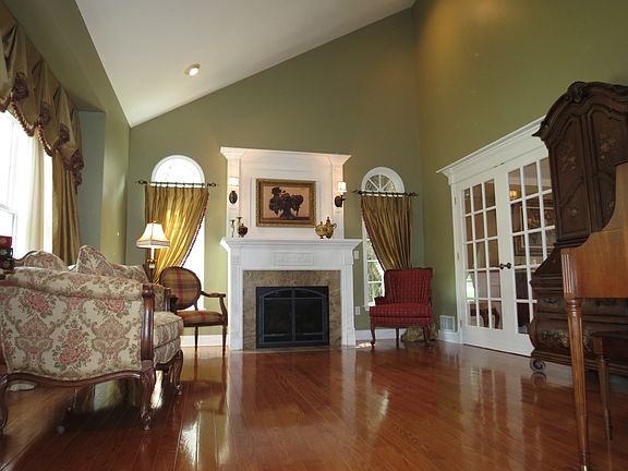 SOARING VAULTED CEILING, BRUCE HWD FLRS, FRENCH DRS, UPGRADED FIREPLACE