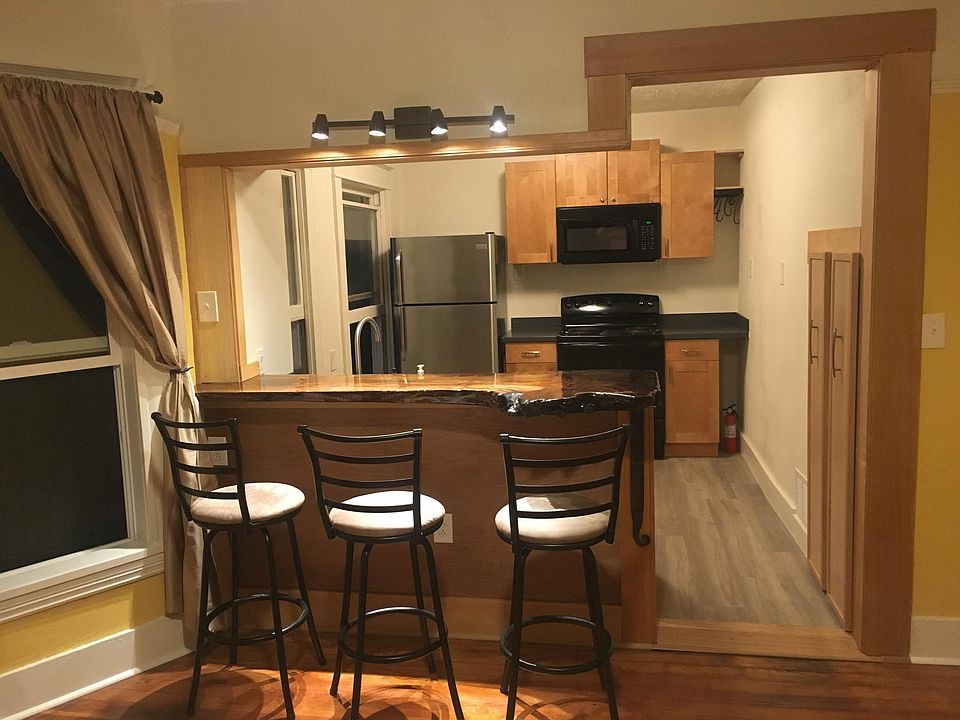 Evening lighting and view from the dining room into kitchen.