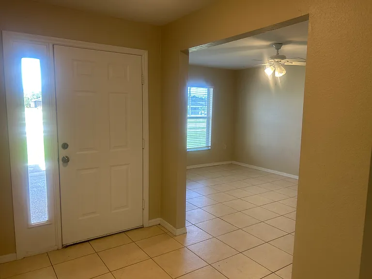 View of front door and 2nd open space at front of home