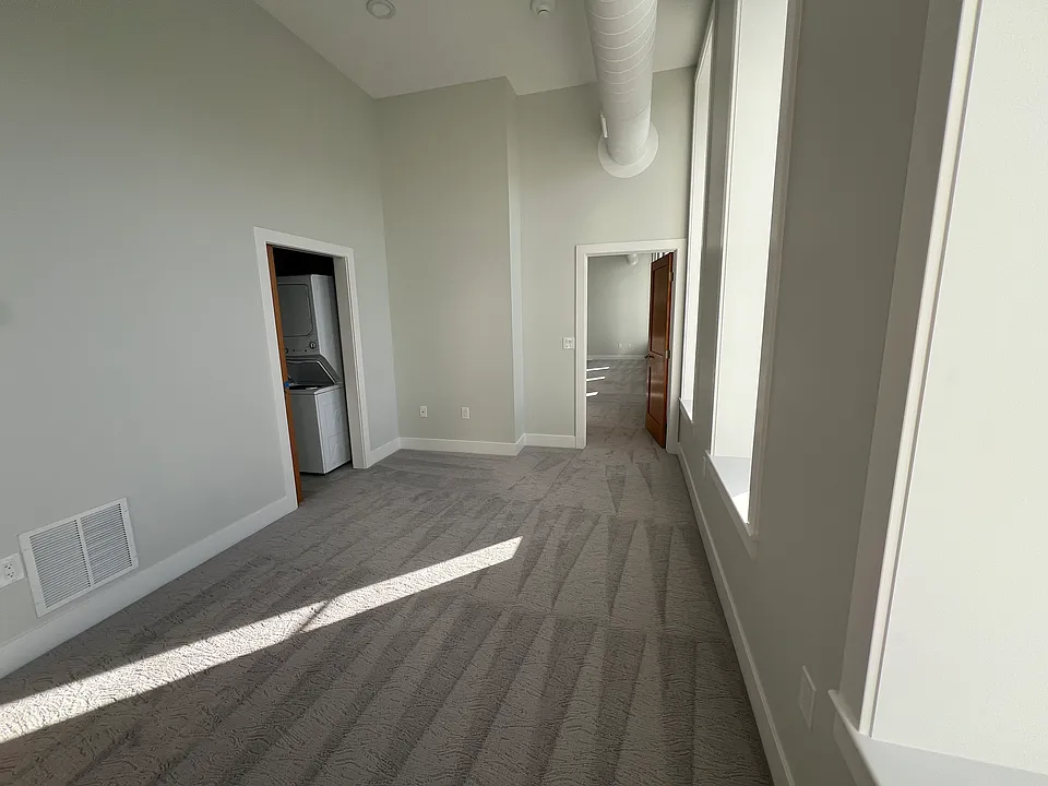 Bedroom with laundry & closet space.